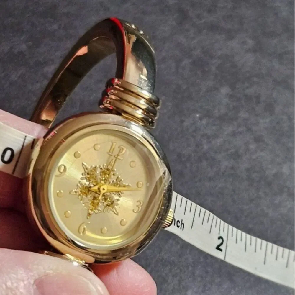 Holiday Lane gold tone snowflake watch
